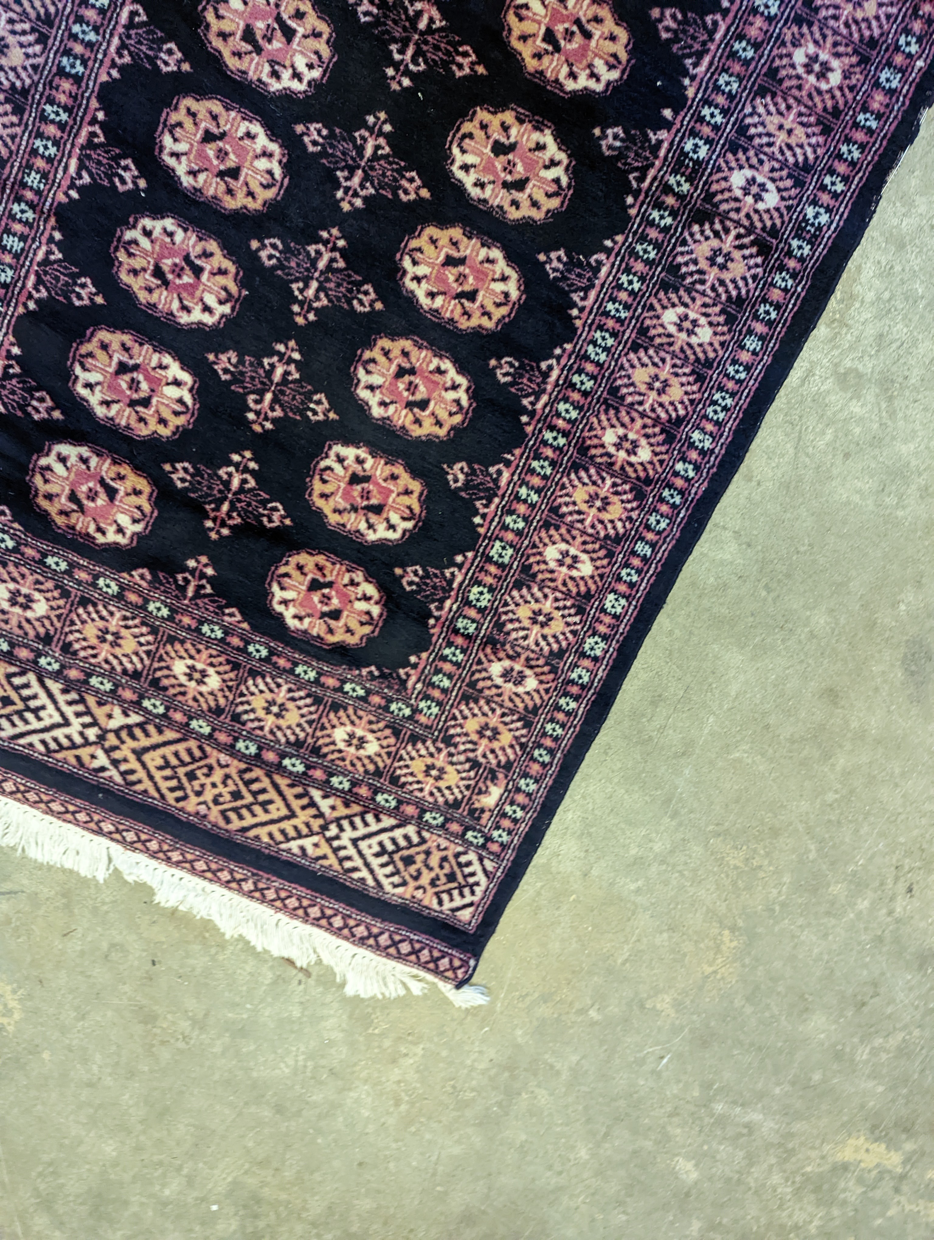 A Bokhara design blue ground rug, 160 x 98cm